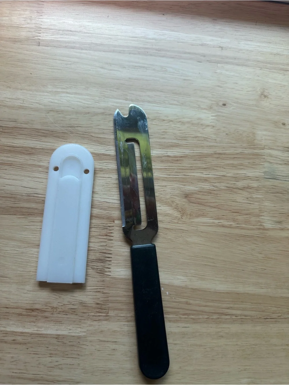 The Pampered Chef Cheese Plane with Black Handle and White Sheath #1125